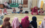 Penyaluran 12 Mushaf Al-Qur'an Hafalan TPA Masjid Nurul Huda